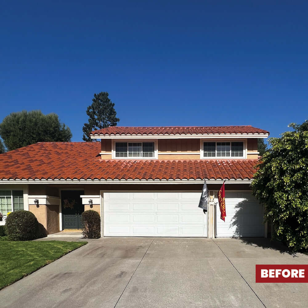 Before image of a house with a red tile roof and concrete driveway, illustrating the outdoor area needing maintenance.