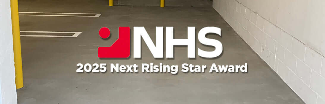 NHS logo with the text '2025 Next Rising Star Award' displayed on a clean concrete surface.