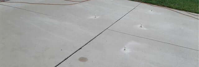 Concrete Repairs | driveway after leveling before using Like-Nu Spray-On Concrete to cover scars and restore color