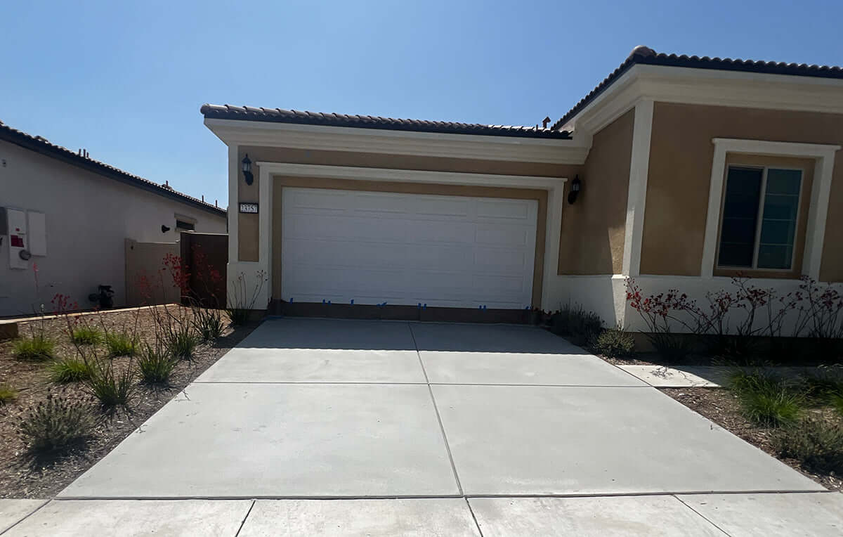 Concrete driveway in front of a modern house showing Like Nu Concrete Resurfacing work