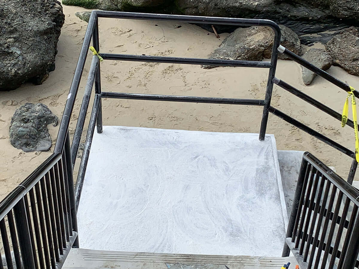 Freshly resurfaced concrete steps at a beach by Like Nu Commercial Services.