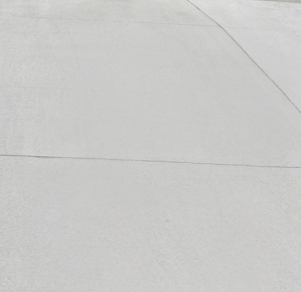 Light tire marks on concrete after