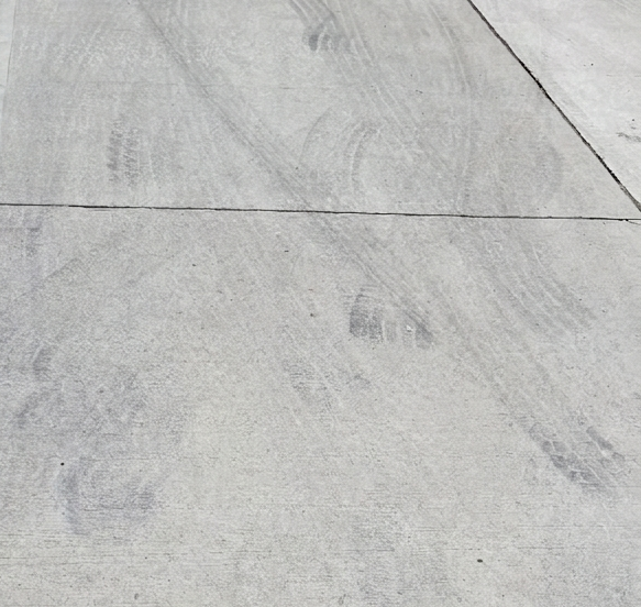 Light tire marks on concrete before