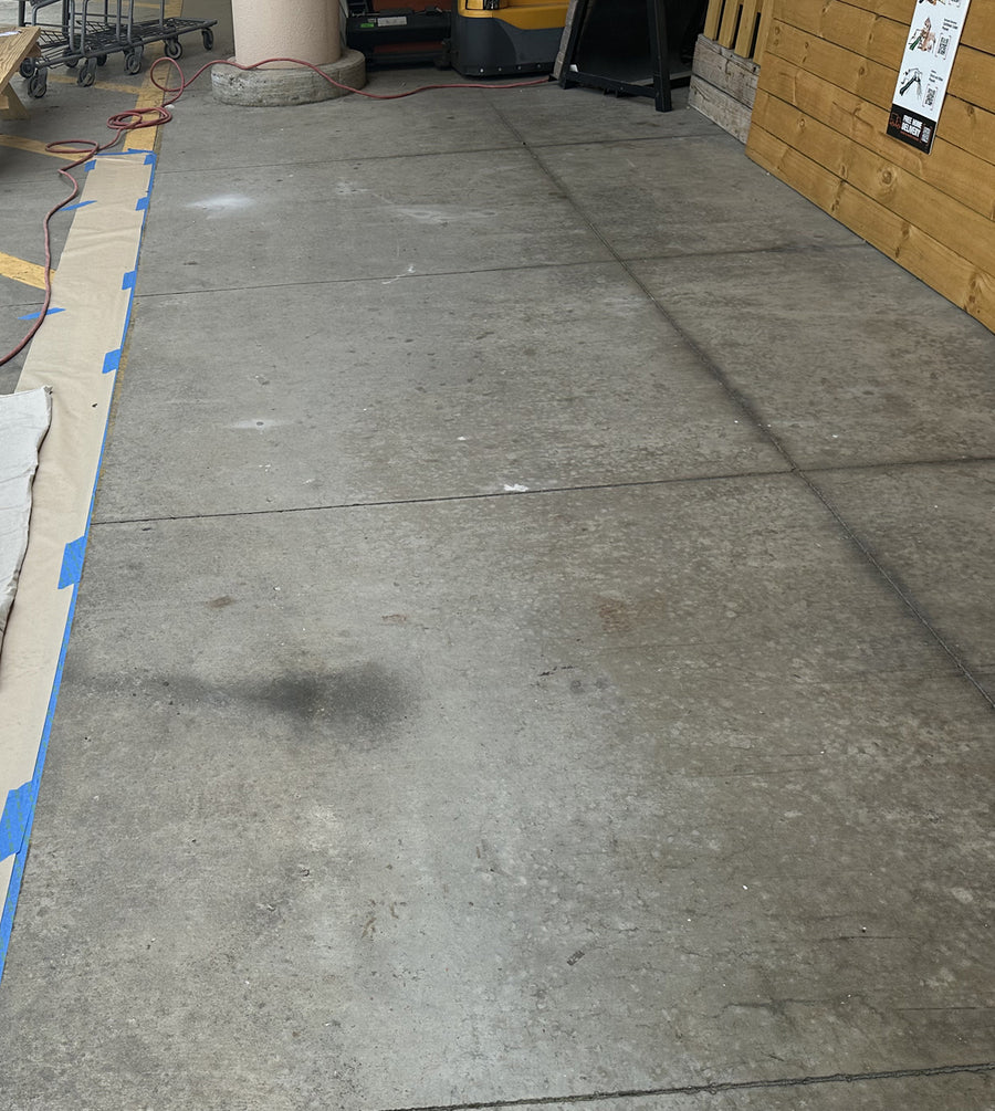Commercial parking structure oil stains before restoration