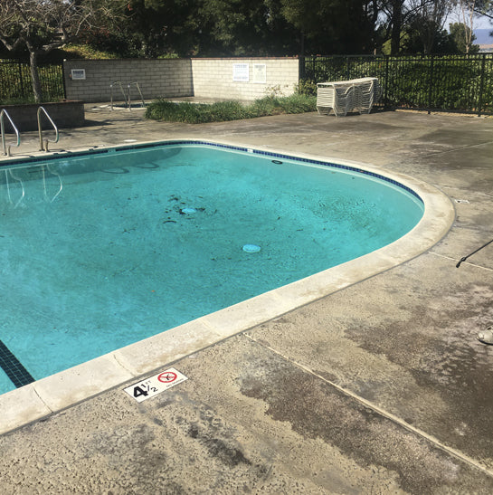 HOA community pool before restoration